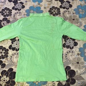 A green turtle neck tunic